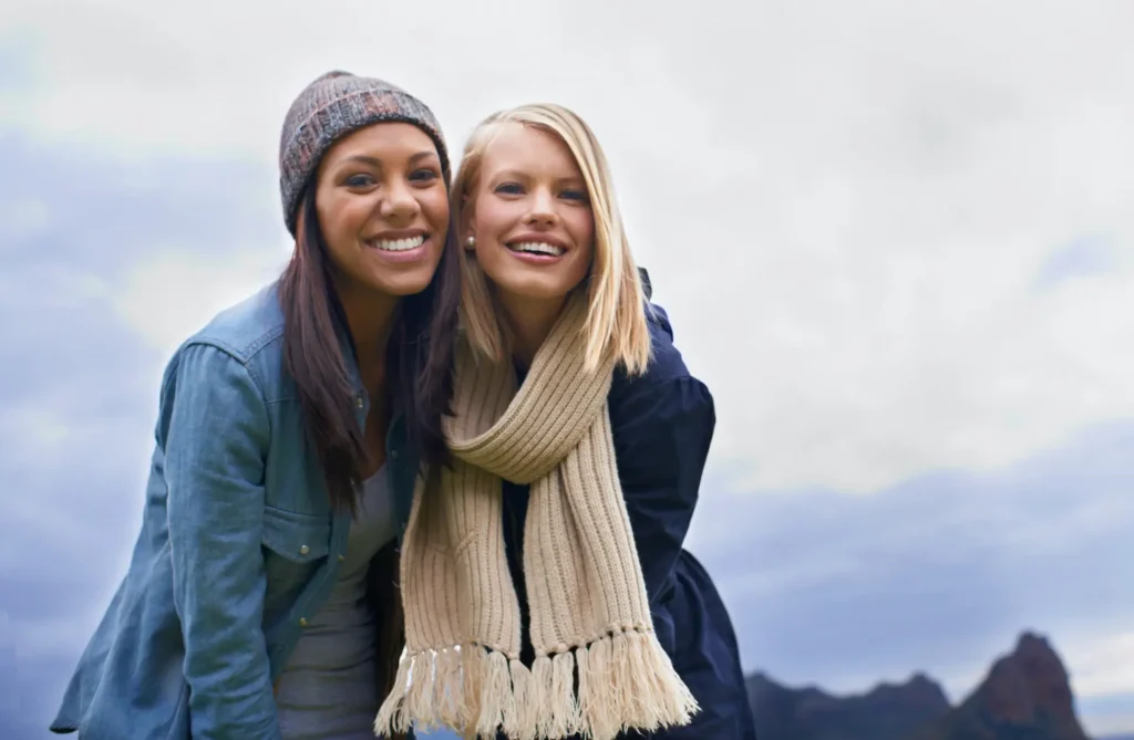 Two Friends Smiling reflecting Arabic proverbs on Friendship