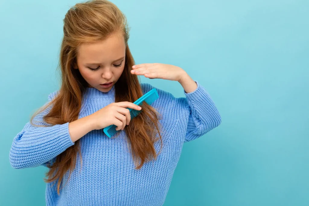 Girl Combing her hair illustrating hair-related verbs and actions